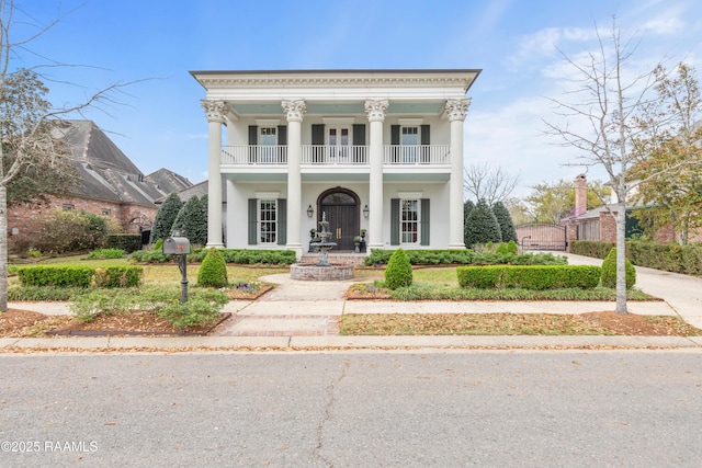 306 Princeton Woods Loop, Lafayette, LA 70508 - greek revival inspired property with a balcony and stucco siding