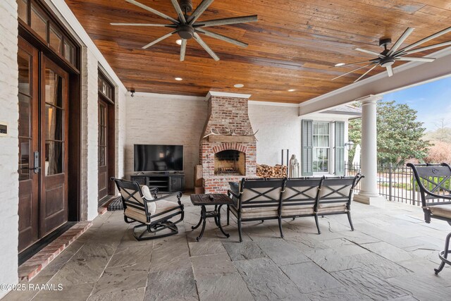 306 Princeton Woods Loop, Lafayette, LA 70508 - view of patio featuring french doors, fence, a ceiling fan, and an outdoor living space with a fireplace