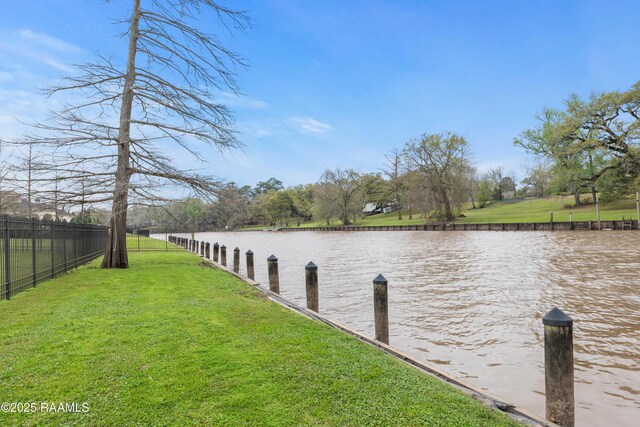 306 Princeton Woods Loop, Lafayette, LA 70508 - dock area featuring a water view, a yard, and fence