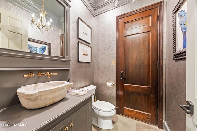 306 Princeton Woods Loop, Lafayette, LA 70508 - bathroom with a notable chandelier, toilet, crown molding, tile patterned flooring, and vanity
