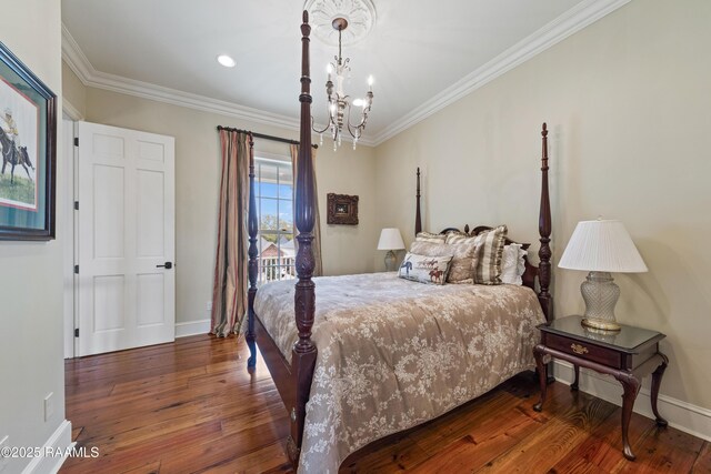 306 Princeton Woods Loop, Lafayette, LA 70508 - bedroom with baseboards, a notable chandelier, wood finished floors, and ornamental molding