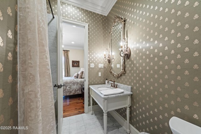 306 Princeton Woods Loop, Lafayette, LA 70508 - ensuite bathroom with toilet, ornamental molding, a sink, ensuite bath, and tile patterned flooring