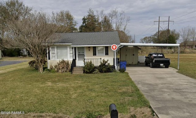 2916 Orangewood Dr, Abbeville, LA 70510 - view of front facade with a carport, concrete driveway, and a front yard