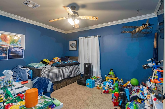 carpeted bedroom featuring visible vents, crown molding, and a ceiling fan