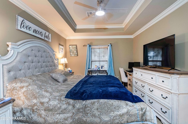 bedroom featuring visible vents, a raised ceiling, ornamental molding, and a ceiling fan