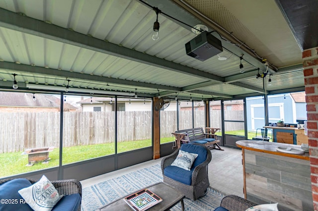 sunroom / solarium featuring plenty of natural light