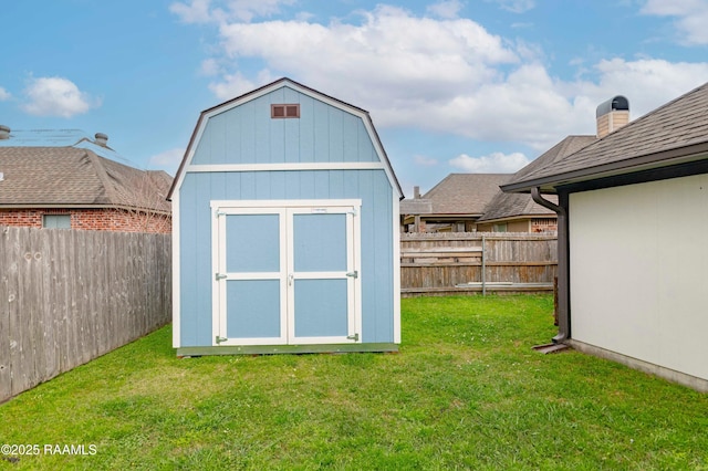 view of shed featuring a fenced backyard