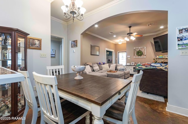 dining area featuring visible vents, ornamental molding, ceiling fan with notable chandelier, recessed lighting, and arched walkways