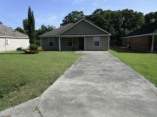 single story home with cooling unit, concrete driveway, and a front yard