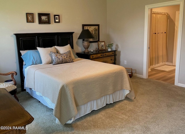 bedroom with baseboards and carpet flooring