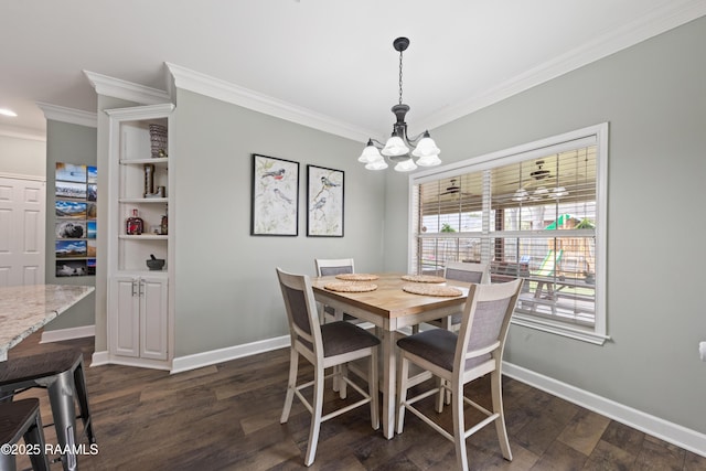 dining space featuring dark wood finished floors, a notable chandelier, baseboards, and ornamental molding