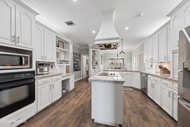 kitchen with crown molding, dark wood finished floors, a peninsula, white cabinets, and black appliances