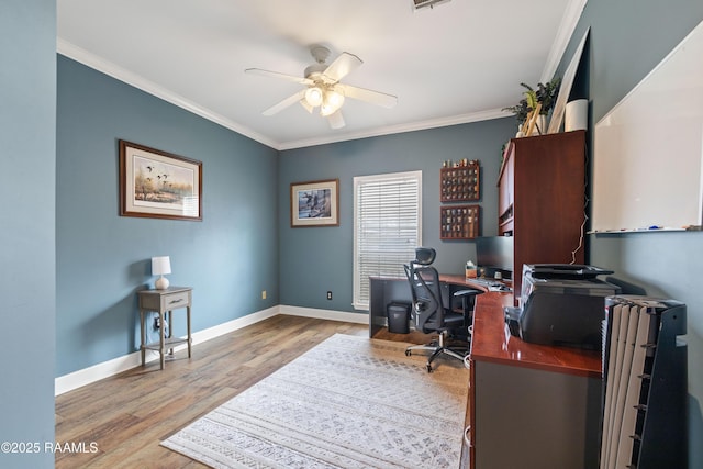 office featuring wood finished floors, visible vents, baseboards, ceiling fan, and crown molding