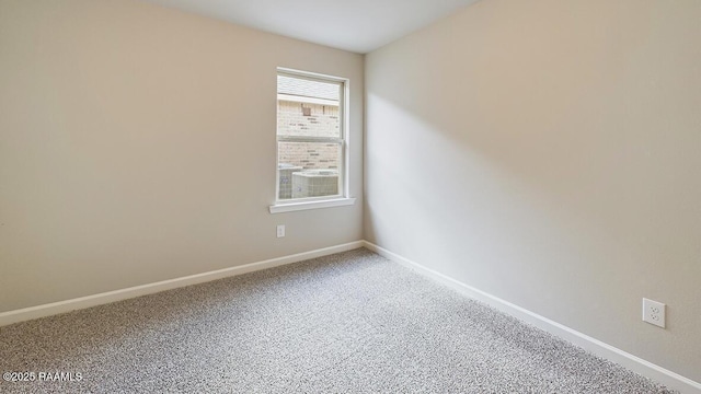 empty room with carpet flooring and baseboards