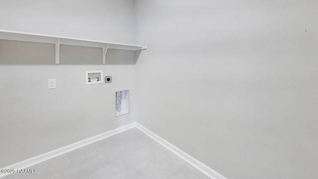 washroom with laundry area, hookup for a washing machine, baseboards, and hookup for an electric dryer