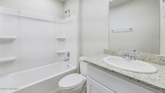 bathroom with shower / bath combination, toilet, and vanity