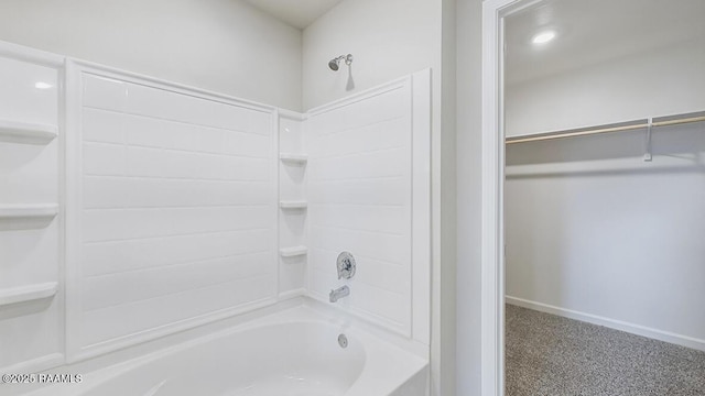 full bath with washtub / shower combination and baseboards