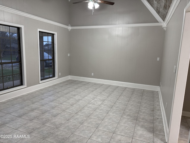 unfurnished room featuring baseboards and ceiling fan