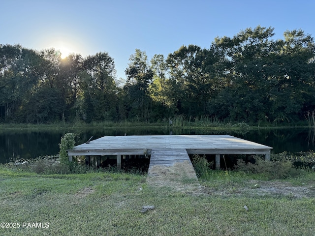 view of outbuilding with a forest view and a water view