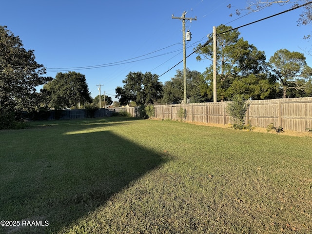 view of yard with a fenced backyard