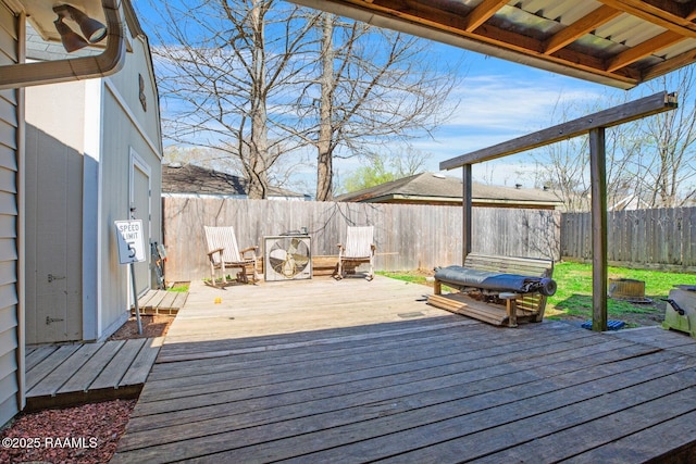 deck with a fenced backyard