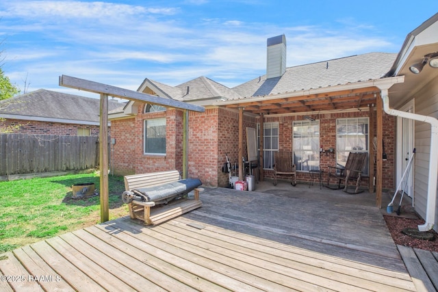 wooden deck featuring fence