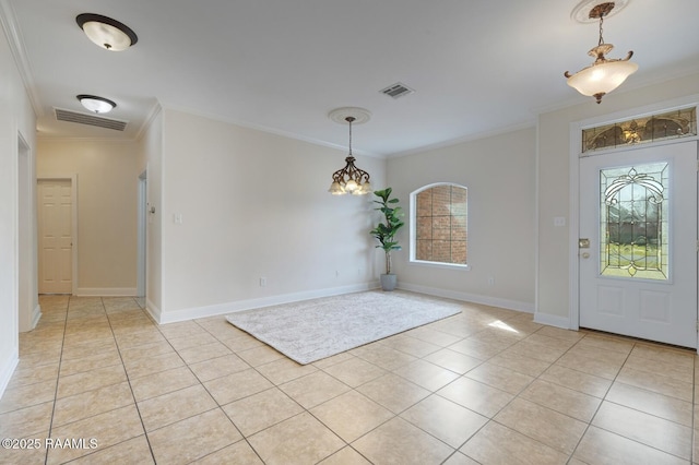 foyer entrance with light tile patterned floors, visible vents, and ornamental molding