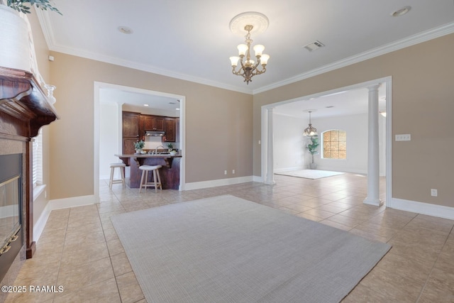 unfurnished living room featuring light tile patterned floors, decorative columns, visible vents, and an inviting chandelier