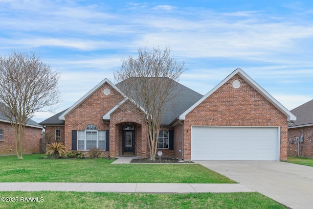 traditional-style house with driveway, a shingled roof, a front yard, an attached garage, and brick siding