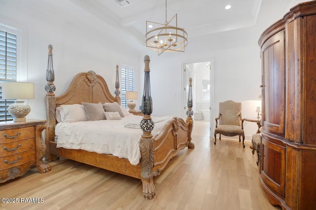 bedroom with connected bathroom, a chandelier, light wood-type flooring, beam ceiling, and recessed lighting