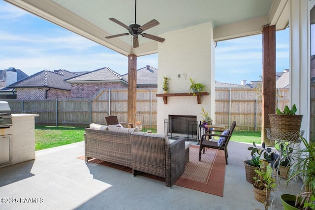 view of patio / terrace with an outdoor hangout area, ceiling fan, and fence