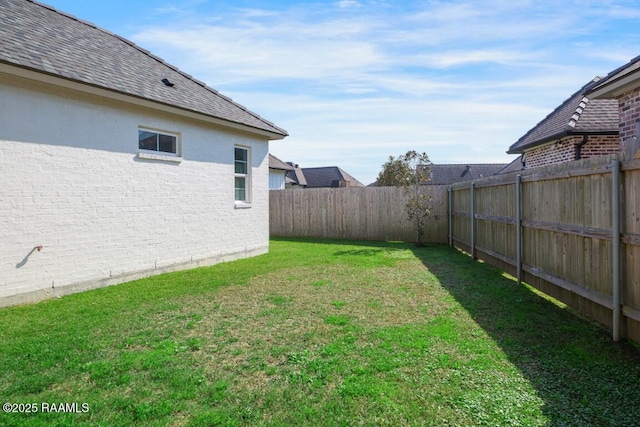 view of yard featuring a fenced backyard