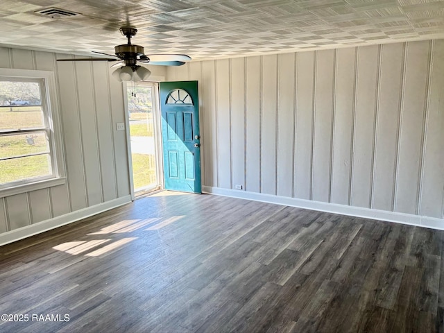 1107 Railroad St, Pine Prairie, LA 70576 - empty room featuring baseboards, wood finished floors, visible vents, and ceiling fan