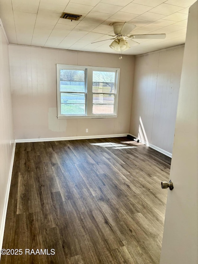 1107 Railroad St, Pine Prairie, LA 70576 - unfurnished room with visible vents, wood finished floors, baseboards, and ceiling fan
