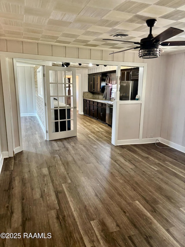 1107 Railroad St, Pine Prairie, LA 70576 - unfurnished living room with dark wood-type flooring, baseboards, visible vents, and ceiling fan