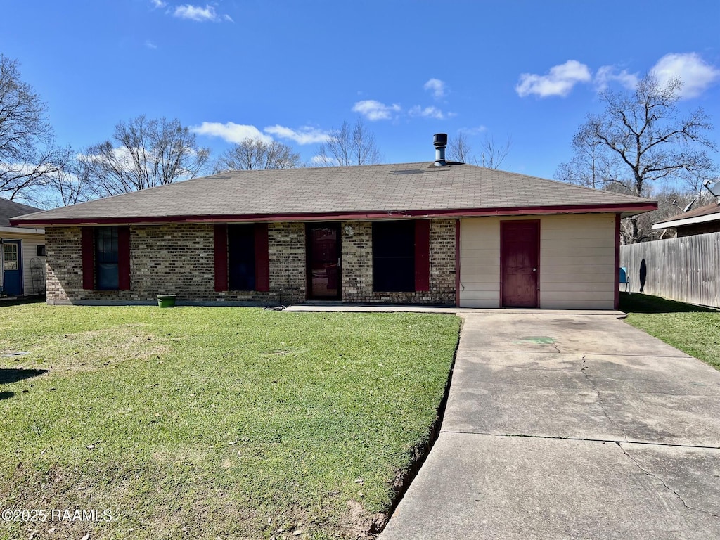 single story home with brick siding, covered porch, a front yard, and fence