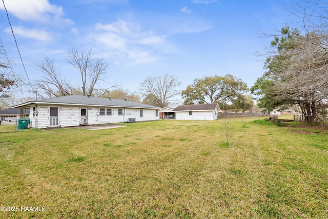 back of property featuring a patio area, cooling unit, fence, and a lawn