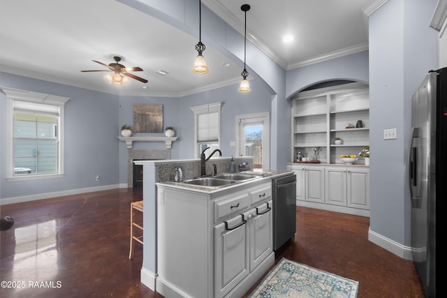 kitchen with baseboards, ceiling fan, dishwasher, freestanding refrigerator, and a sink