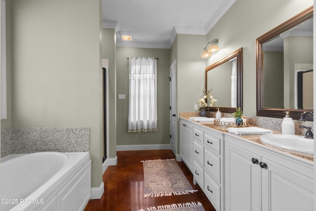 full bathroom featuring a sink, ornamental molding, double vanity, and a bath