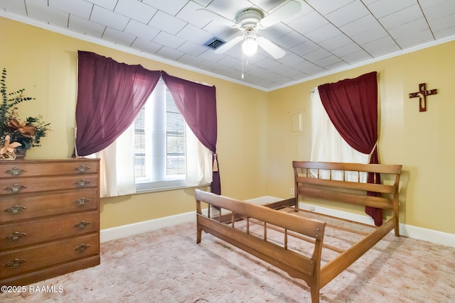 bedroom with visible vents, crown molding, and baseboards