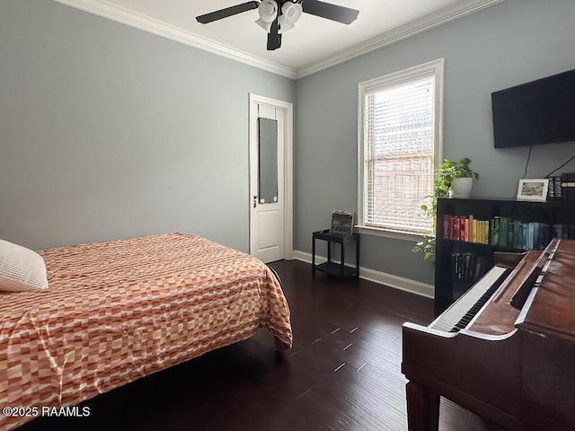 bedroom featuring wood finished floors, baseboards, ornamental molding, and a ceiling fan