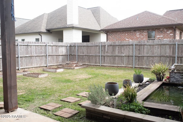 view of yard featuring a fenced backyard