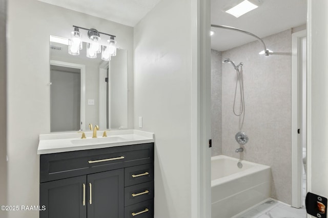 full bath with marble finish floor, toilet, vanity, and  shower combination