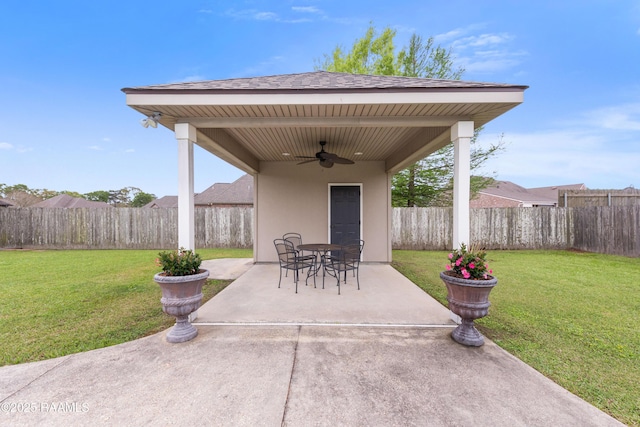 view of patio / terrace with a fenced backyard and a ceiling fan