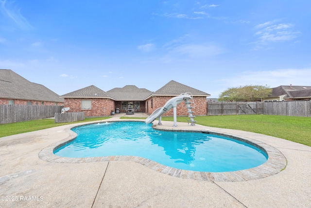 view of pool featuring a fenced in pool, a water slide, a fenced backyard, a patio, and a yard