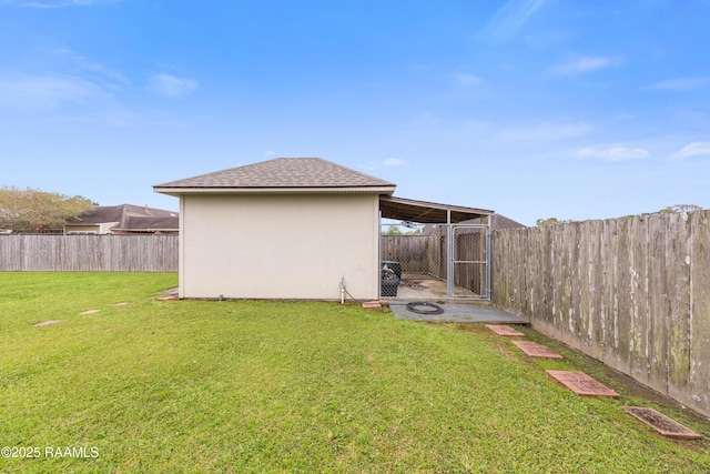 view of yard with a fenced backyard