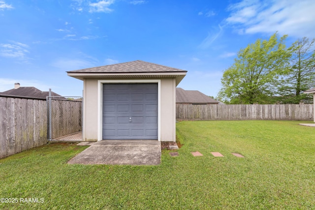 garage featuring a shed and fence