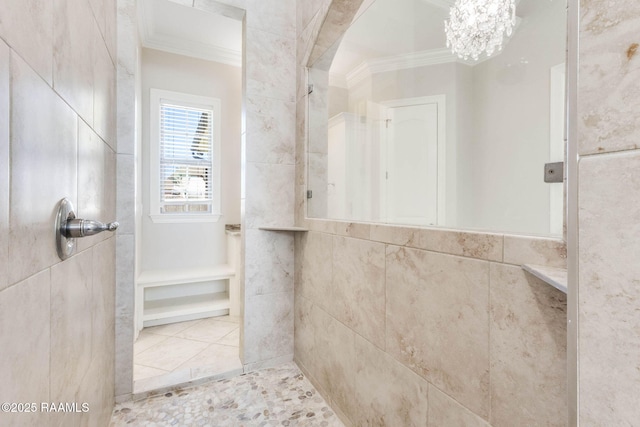 full bath with tile walls, an inviting chandelier, walk in shower, tile patterned flooring, and ornamental molding