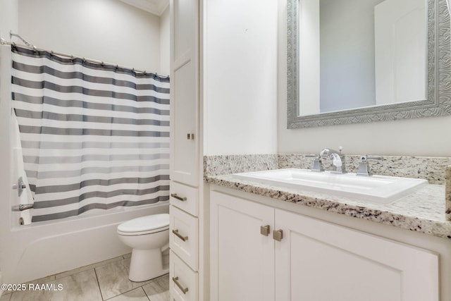 full bath featuring shower / tub combo, toilet, and vanity