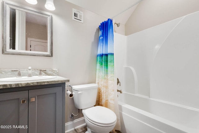 full bathroom featuring vanity, baseboards, toilet, lofted ceiling, and shower / bath combo with shower curtain